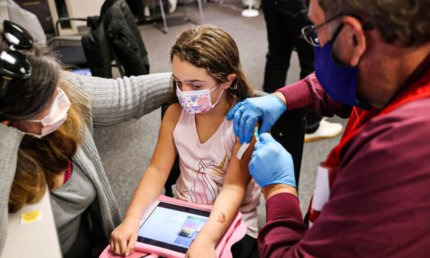 A child receives the Pfizer-BioNTech COVID-19 vaccination at the Fairfax County Government Center  in Annandale, Va., on Nov. 4, 2021. (Chip Somodevilla/Getty Images)