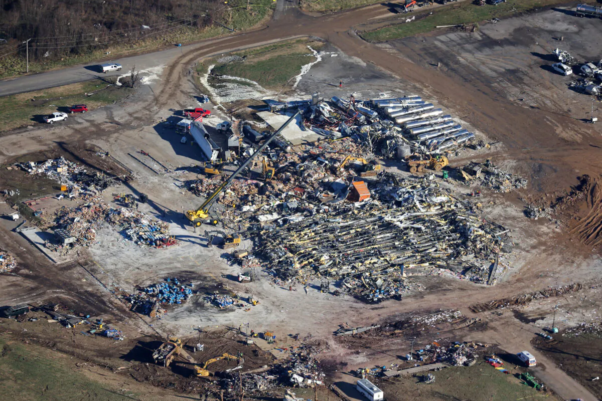 In this aerial view, crews clear the rubble at the Mayfield Consumer Products candle factory after it was destroyed by a tornado three days prior, on December 13, 2021 in Mayfield, Kentucky. (Scott Olson/Getty Images)