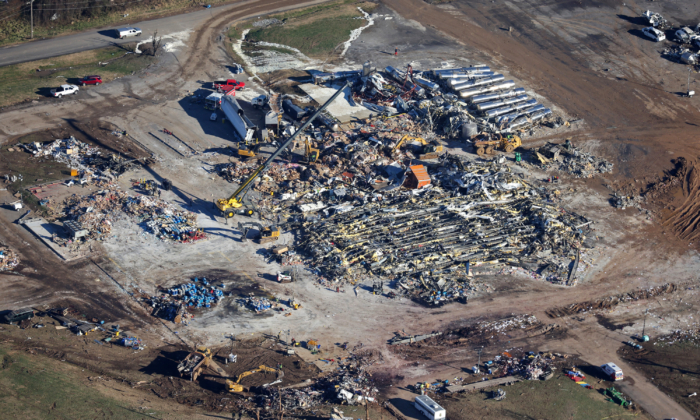 In this aerial view, crews clear the rubble at the Mayfield Consumer Products candle factory after it was destroyed by a tornado three days prior, on December 13, 2021 in Mayfield, Kentucky. (Scott Olson/Getty Images)