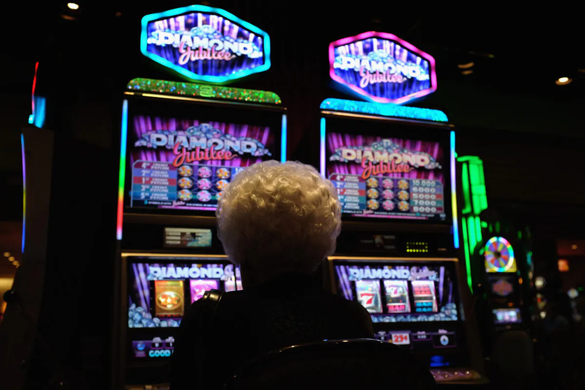 An elderly woman plays slot machines in a casino on the Atlantic City Boardwalk in Atlantic City, N.J., in a file photo. (John Moore/Getty Images)