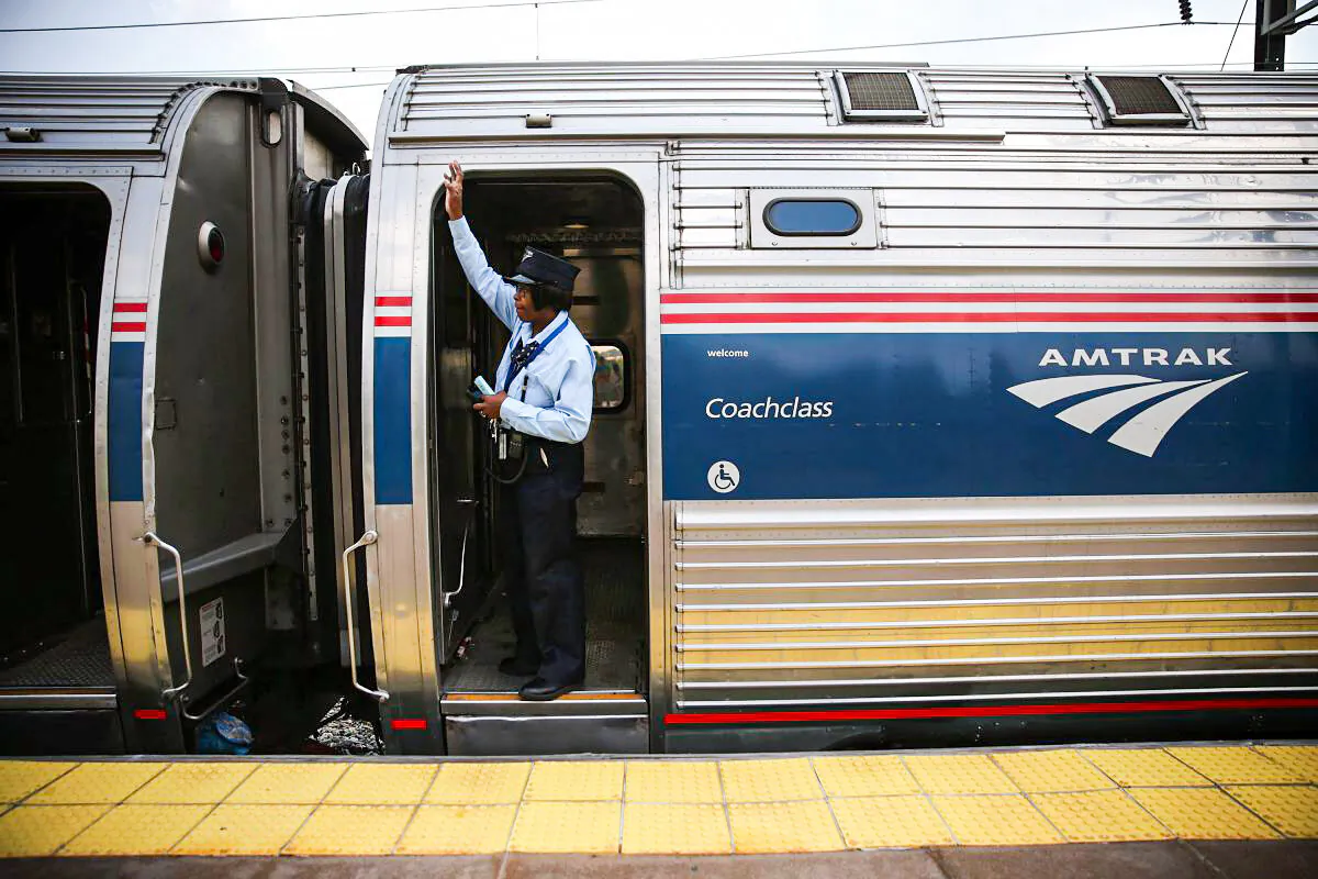 A train conductor signals from an Amtrak train September 3, 2015 in New Carrollton, Maryland. U.S. (Alex Wong/Getty Images)
