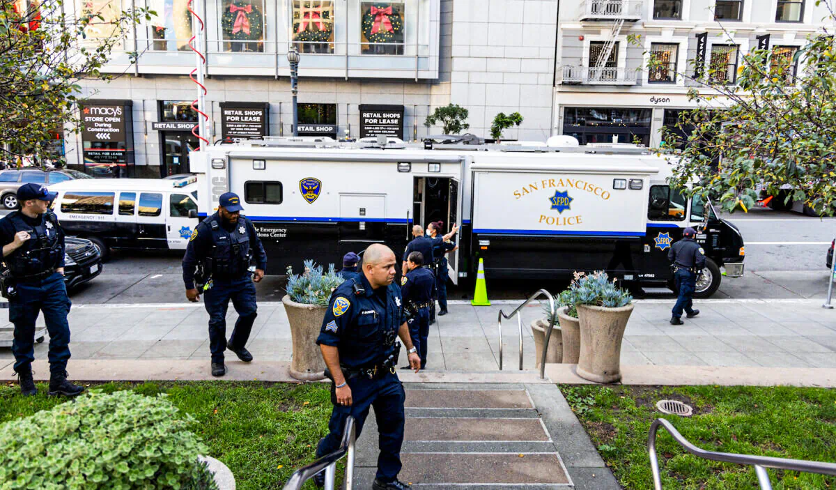 Police patrol Union Square in San Francisco on Nov. 30, 2021. Stores have increased security in response to a spike in thefts. (Ethan Swope/Getty Images)