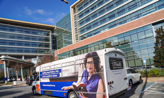 A UF Health bus arrives to drop off patients at the UF Health Heart and Vascular Hospital in Gainesville, Fla. on Dec. 14. (Nanette Holt/The Epoch Times)