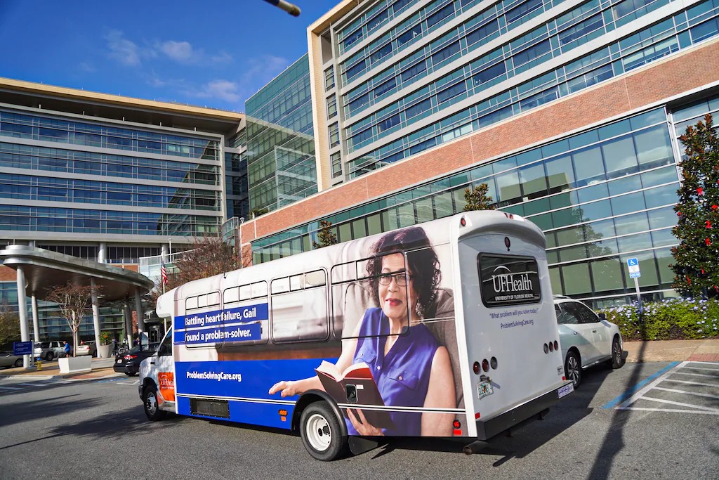 A UF Health bus arrives to drop off patients at the UF Health Heart and Vascular Hospital in Gainesville, Fla. on Dec. 14. (Nanette Holt/The Epoch Times)