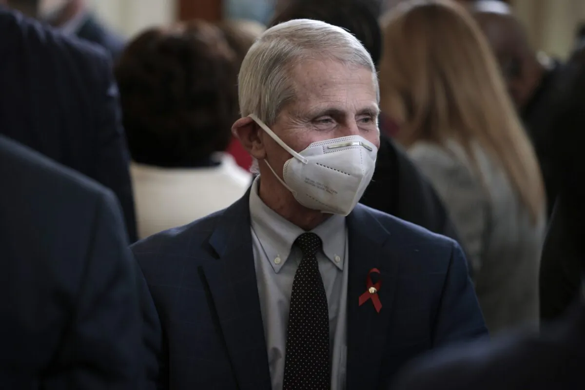 Dr. Anthony Fauci speaks with people at the White House in Washington on Dec. 1, 2021. (Anna Moneymaker/Getty Images)