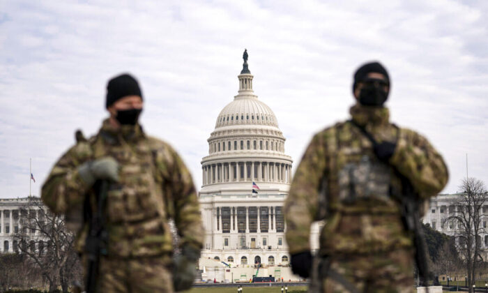 Members of the National Guard patrol the area outside of the U.S. Capitol during the impeachment trial of former president Donald Trump at the Capitol in Washington on Feb. 10, 2021. (Jose Luis Magana/AP Photo)