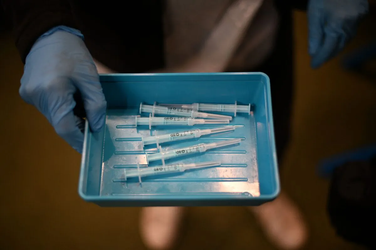 Syringes with Moderna's COVID-19 vaccine sit on a tray in a vaccination center in London on Dec. 4, 2021. (Daniel Leal/AFP via Getty Images)