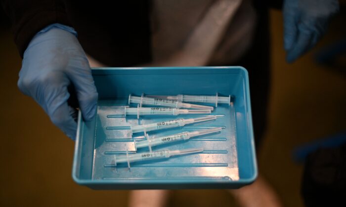 Syringes with Moderna's COVID-19 vaccine sit on a tray in a vaccination center in London on Dec. 4, 2021. (Daniel Leal/AFP via Getty Images)