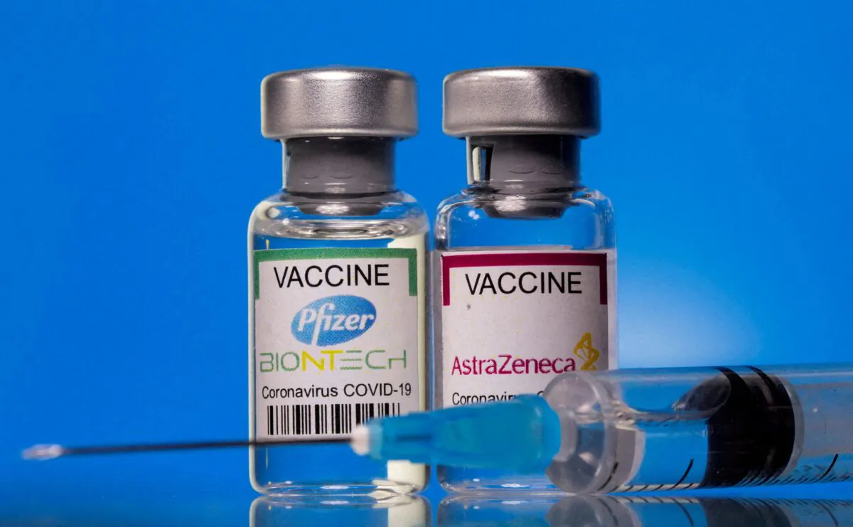 Vials with Pfizer-BioNTech and AstraZeneca COVID-19 vaccine labels are seen in this illustration picture taken on March 19, 2021. (Dado Ruvic/Illustration/Reuters)