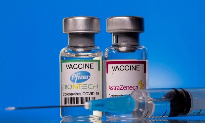 Vials with Pfizer-BioNTech and AstraZeneca COVID-19 vaccine labels are seen in this illustration picture taken on March 19, 2021. (Dado Ruvic/Illustration/Reuters)