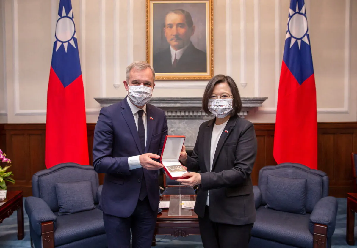 Taiwan President Tsai Ing-wen and François de Rugy, head of the France–Taiwan Parliamentary Friendship Group, attend a meeting at the Presidential Office in Taipei, Taiwan, on Dec. 16, 2021. (Taiwan Presidential Office/Handout via Reuters)
