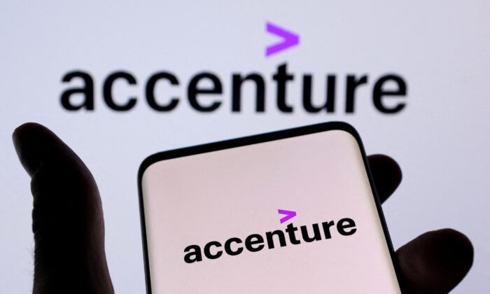 Accenture PLC's logo is seen on a smartphone in front of a displayed same logo in this illustration taken on Dec. 1, 2021. (Dado Ruvic/Illustration/Reuters)