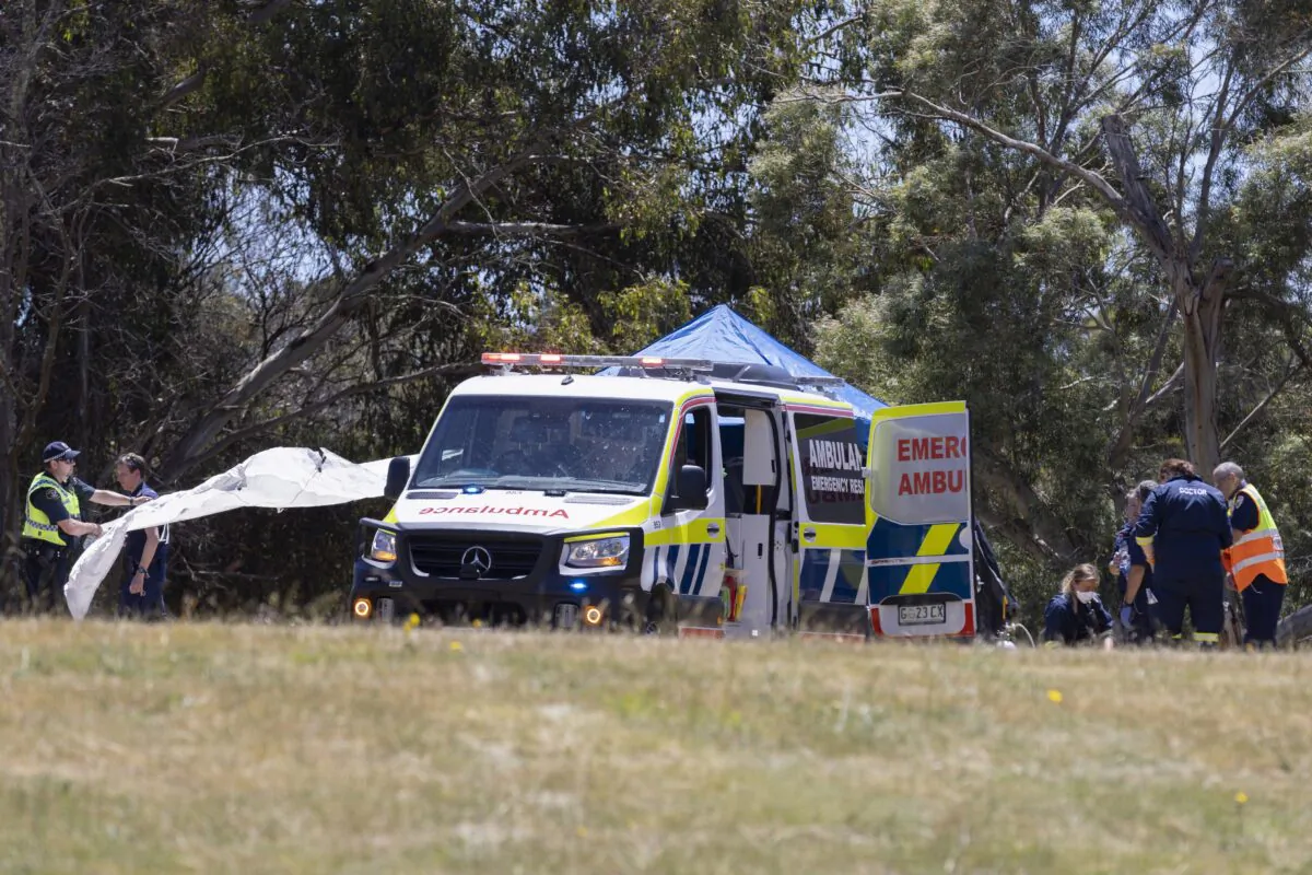 Emergency services personnel work the scene of a deadly incident involved with a bouncy castle at the Hillcrest Primary School in Devonport, Tasmania, on Dec. 16, 2021. (Grant Wells/AAP Image via AP)