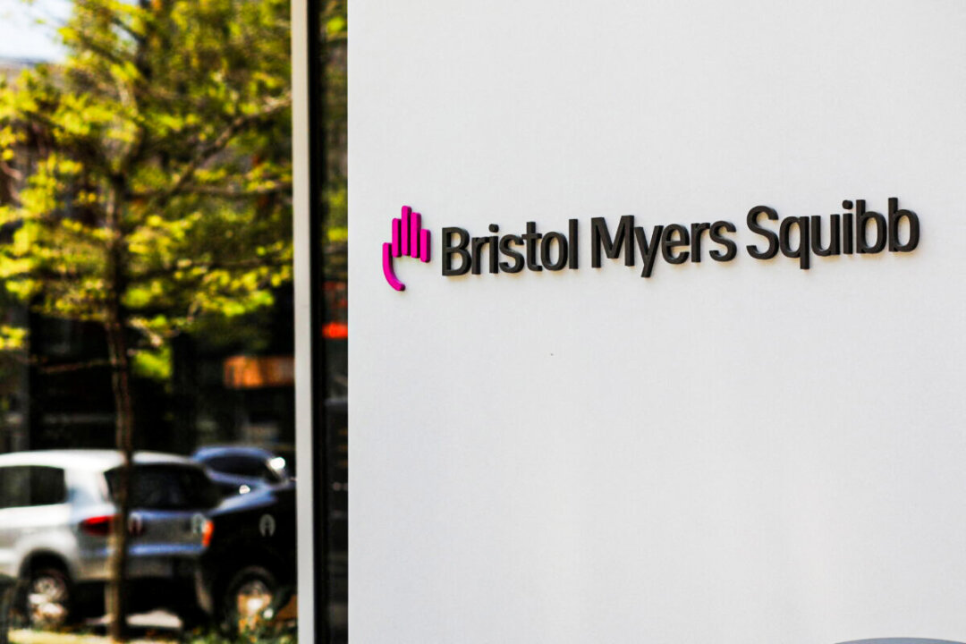 A sign stands outside a Bristol Myers Squibb facility in Cambridge, Mass., on May 20, 2021. (Brian Snyder/Reuters)