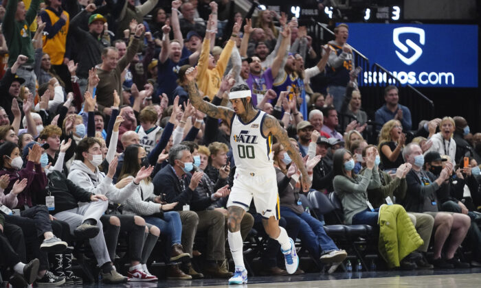 Utah Jazz guard Jordan Clarkson (00) celebrates after making a 3-pointer against the Los Angeles Clippers in the second half during an NBA basketball game in Salt Lake City on Dec. 15, 2021. (AP Photo/Rick Bowmer)