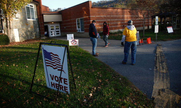 A voter makes his way into a polling place to cast his ballot in the early morning at the Valle Crucis School on Nov. 3, 2020, in Sugar Grove, N.C. (Brian Blanco/Getty Images)