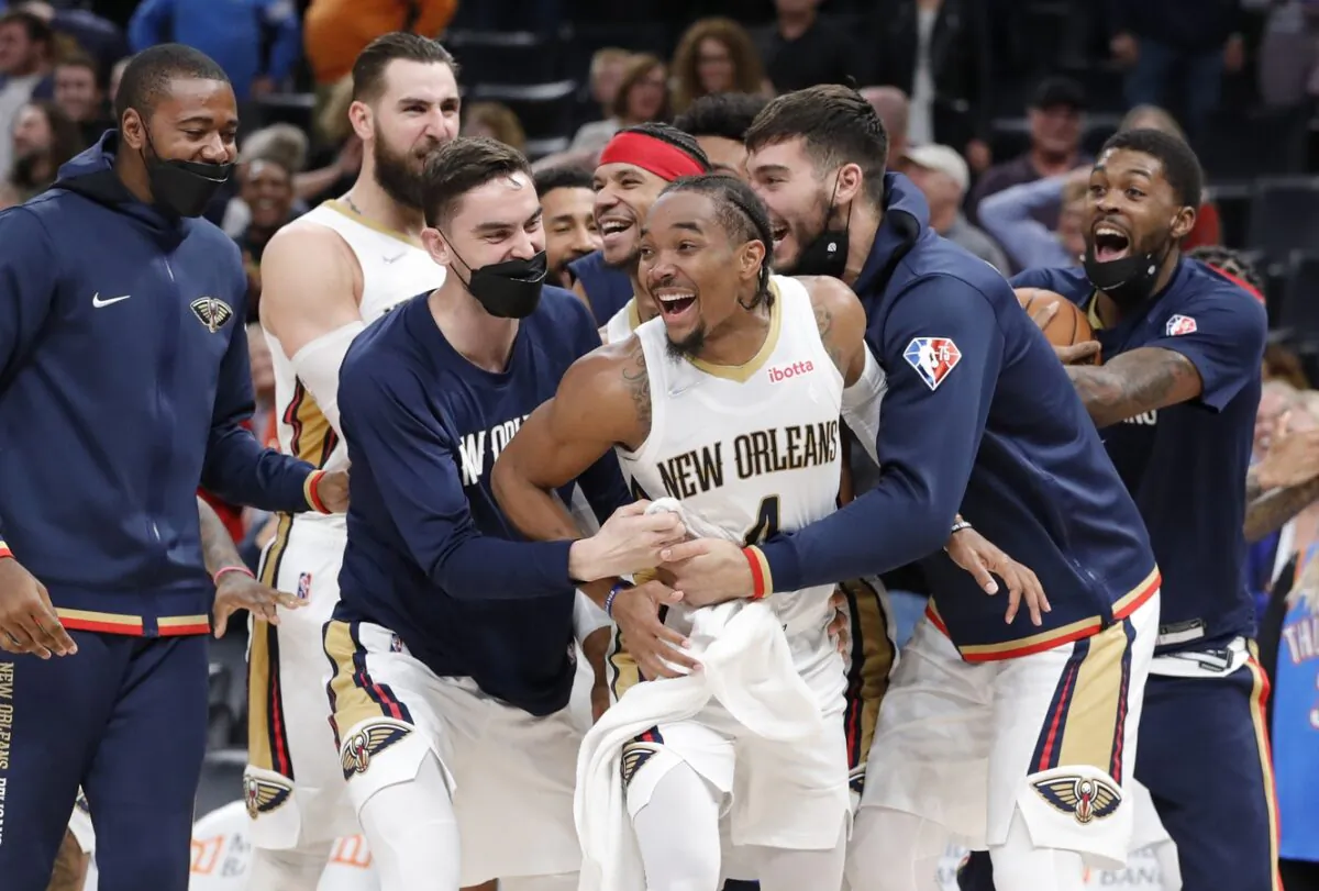 New Orleans Pelicans guard Devonte' Graham (4) celebrates with his team during an NBA game at Paycom Center, in Oklahoma City, O.K., on Dec. 15, 2021. (Alonzo Adams/USA TODAY Sports via Field Level Media)