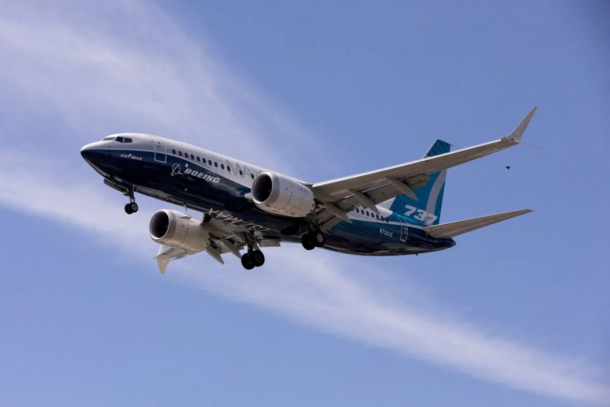 A Boeing 737 MAX airplane lands after a test flight at Boeing Field in Seattle, Wash., on June 29, 2020. (Karen Ducey/Reuters)