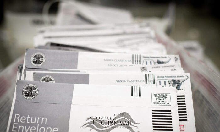 Mail-in ballots in their envelopes await processing at the Los Angeles County Registrar Recorders' mail-in ballot processing center at the Pomona Fairplex in Pomona, Calif., on Oct. 28, 2020. (ROBYN BECK/AFP via Getty Images)