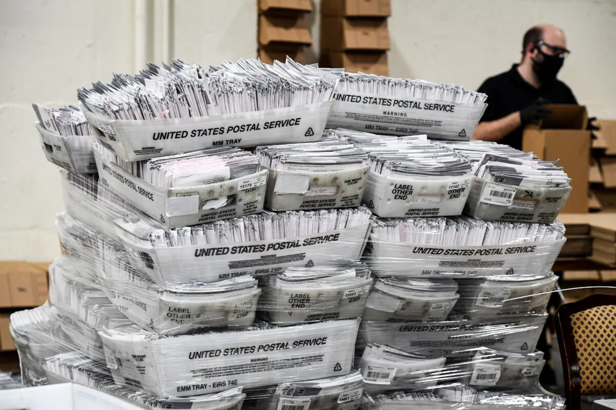 Mail-in ballots in their envelopes await processing at the Los Angeles County Registrar Recorders' mail-in ballot processing center at the Pomona Fairplex in Pomona, Calif., on Oct. 28, 2020. (Robyn Beck/AFP via Getty Images)