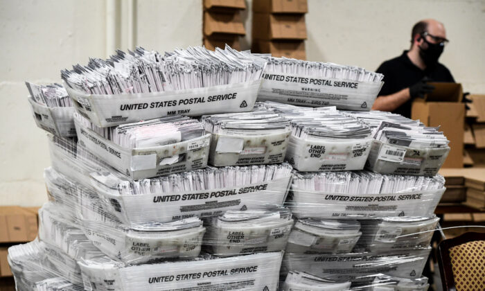 Mail-in ballots in their envelopes await processing at the Los Angeles County Registrar Recorders' mail-in ballot processing center at the Pomona Fairplex in Pomona, Calif., on Oct. 28, 2020. (Robyn Beck/AFP via Getty Images)