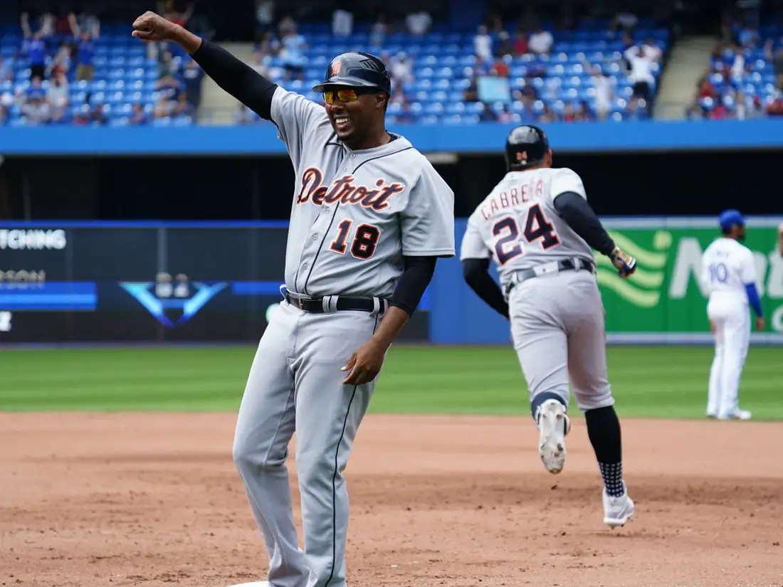 Detroit Tigers first base coach Kimera Bartee (18) celebrartes designated hitter Miguel Cabrera (24) solo homerun against the Toronto Blue Jays in the sixth inning at Rogers Centre, in Toronto, Canada, on Aug. 22, 2021. (John E. Sokolowski/USA TODAY Sports via Field Level Media)