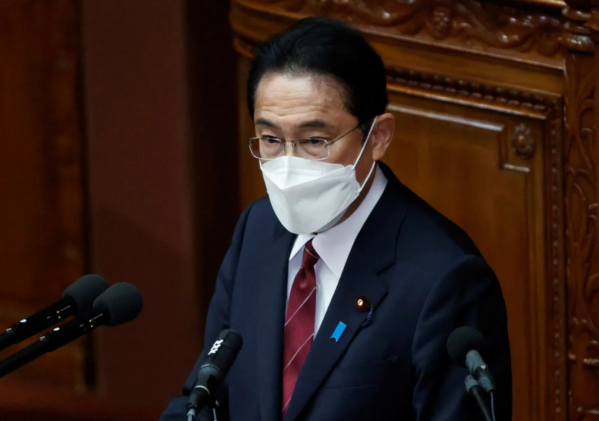 Japan's Prime Minister Fumio Kishida wearing a face mask delivers his policy speech at the start of an extraordinary session of the lower house of the parliament, amid the COVID-19 pandemic, in Tokyo, on Dec. 6, 2021. (Issei Kato/Reuters)