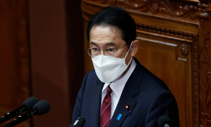 Japan's Prime Minister Fumio Kishida wearing a face mask delivers his policy speech at the start of an extraordinary session of the lower house of the parliament, amid the COVID-19 pandemic, in Tokyo, on Dec. 6, 2021. (Issei Kato/Reuters)