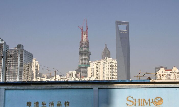 A wall carrying the logo of Shimao Group in Shanghai, China, on Jan. 1, 2013. (Stringer/Reuters)