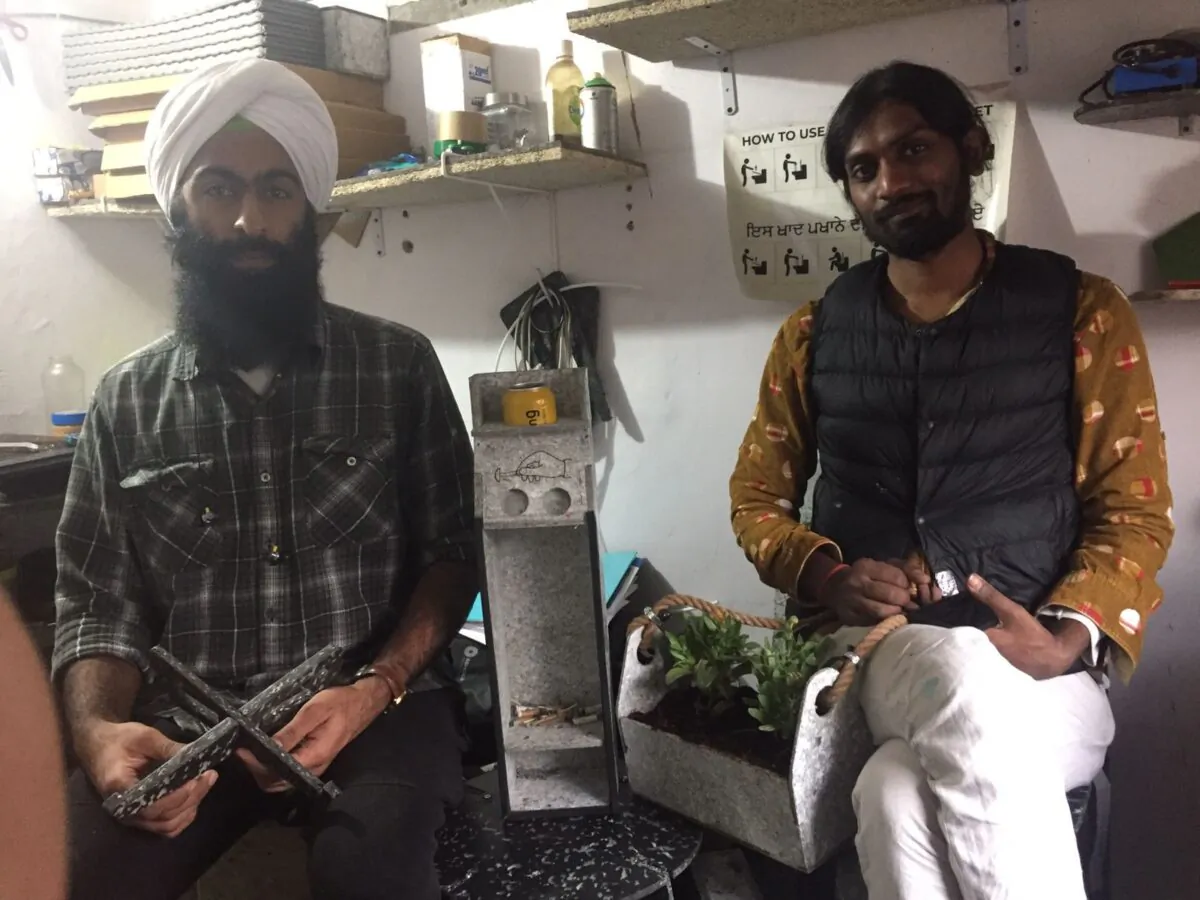 Ashwini Agarwal (R) and Sahaj Umang Singh of Basic SHIT organization in their studio in Narojini in New Delhi on Nov. 30, 2021. (Venus Upadhayaya/Epoch Times)