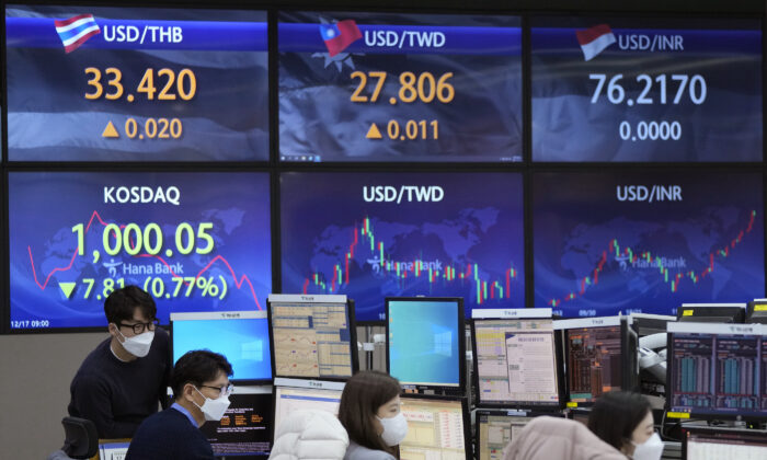Currency traders watch monitors at the foreign exchange dealing room of the KEB Hana Bank headquarters in Seoul, South Korea, on Dec. 17, 2021. (Ahn Young-joon/AP Photo)