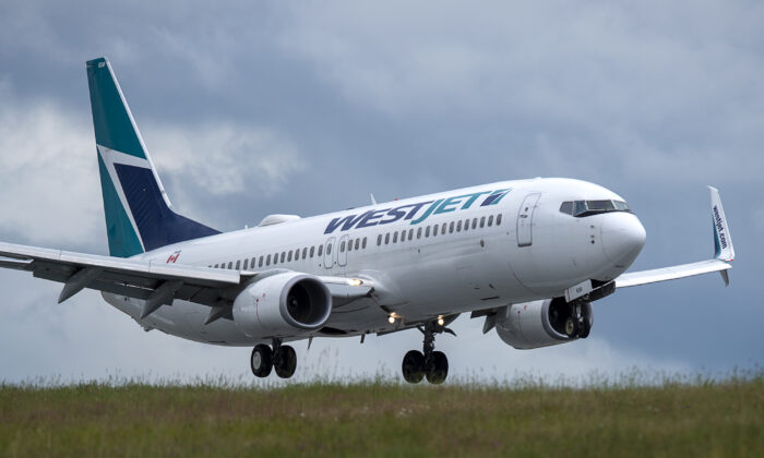 A WestJet flight from Calgary arrives at Halifax Stanfield International Airport in Enfield, N.S., on July 6, 2020. (The Canadian Press/Andrew Vaughan)