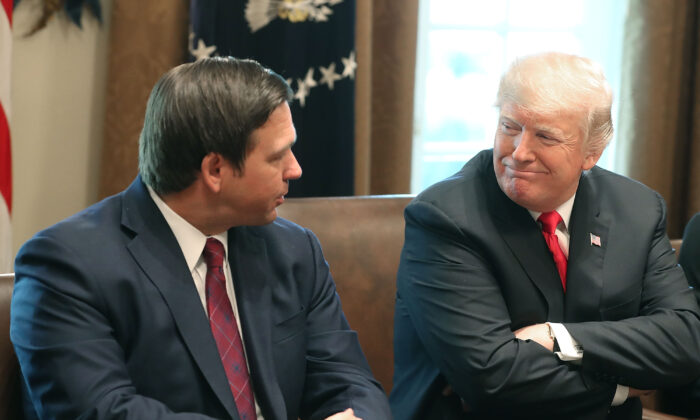 Florida Governor-elect Ron DeSantis (R) sits next to President Donald Trump during a meeting with Governors elects in the Cabinet Room at the White House on Dec. 13, 2018. (Mark Wilson/Getty Images)