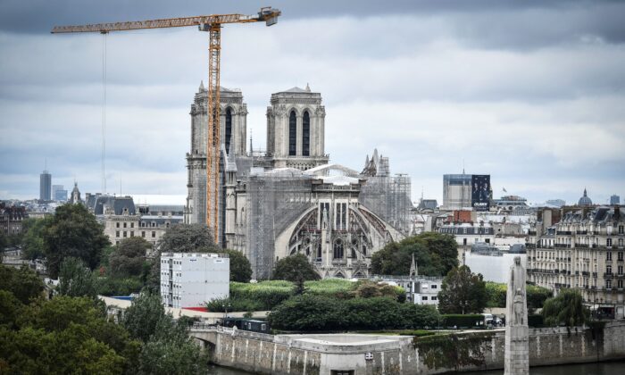 A giant crane outside Notre-Dame Cathedral in Paris on Aug. 19, 2021. (Stephane de Sakutin/AFP via Getty Images)