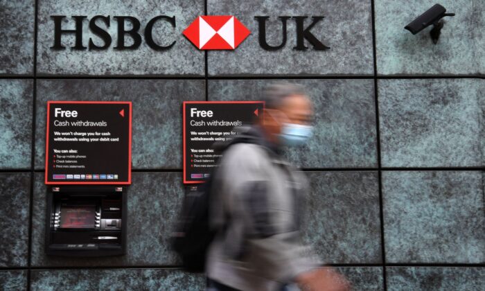 A pedestrian walks past a branch of a HSBC bank in central London on Aug. 3, 2020. (Daniel Leal/AFP via Getty Images)