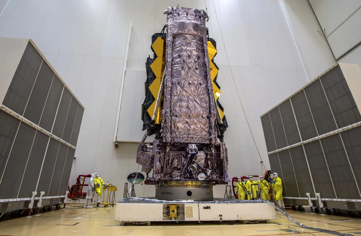NASA’s James Webb Space Telescope is secured on top of the Ariane 5 rocket that will launch it to space from Europe’s Spaceport in French Guiana, on Dec. 11, 2021. (M.Pedoussaut/ESA via AP)