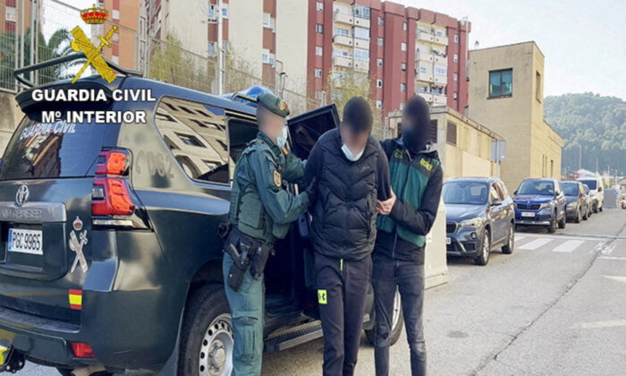 Members of the Spanish Civil Guard during the raid to arrest internationally wanted drug trafficker Fikri Amellah and 16 people from his network in Barcelona, Spain, on Dec. 17, 2021. (Guardia Civil-Ministerio del Interior/Handout via Reuters)