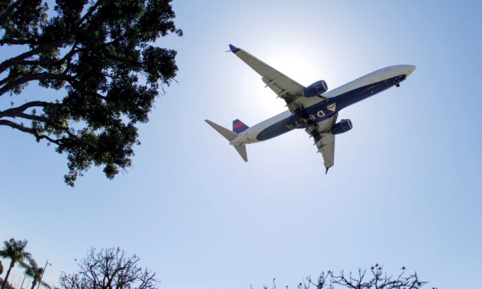 A Delta Airlines passenger jet approaches to land at LAX in Los Angeles on April 7, 2021. (Mike Blake/Reuters)