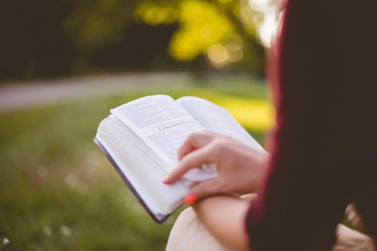A person reading the bible. (Ben White/Unsplash)