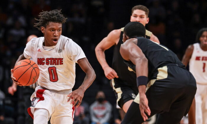 North Carolina State Wolfpack guard Terquavion Smith (0) dribbles up court  against North Carolina State Wolfpack guard Thomas Allen (5) during the second half at Barclays Center, Brooklyn, New York, on Dec 12, 2021. (Vincent Carchietta/USA TODAY Sports Via Field Level Media)