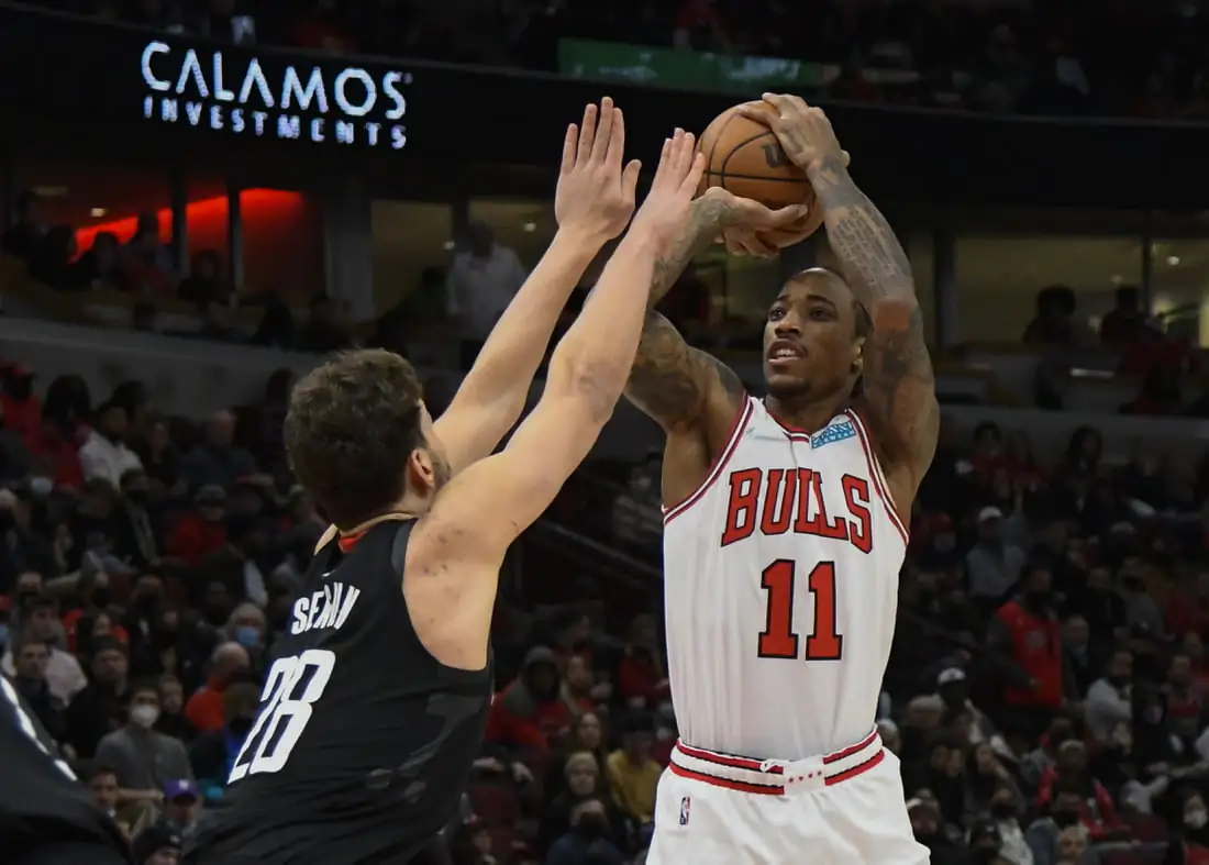 Chicago Bulls forward DeMar DeRozan (11) shoots the ball against Houston Rockets center Alperen Sengun (28) during the first half at the United Center in Chicago on Dec 20, 2021. (Matt Marton/USA TODAY Sports via Field Level Media)