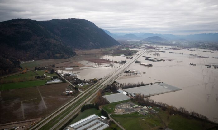 The Trans-Canada Highway and surrounding farmlands are inundated by floodwaters in Abbotsford, B.C., on Nov. 22, 2021. (The Canadian Press/Darryl Dyck)