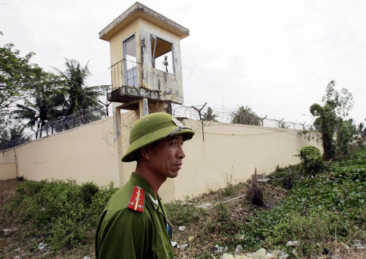 A 2006 file image of a Vietnamese policeman standing watch outside the Phuoc Co jail on the outskirts of the southern coastal town of Vung Tau. (Hoang Dinh Nam/AFP via Getty Images)