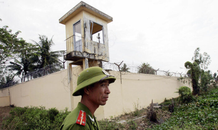 A 2006 file image of a Vietnamese policeman standing watch outside the Phuoc Co jail on the outskirts of the southern coastal town of Vung Tau. (Hoang Dinh Nam/AFP via Getty Images)
