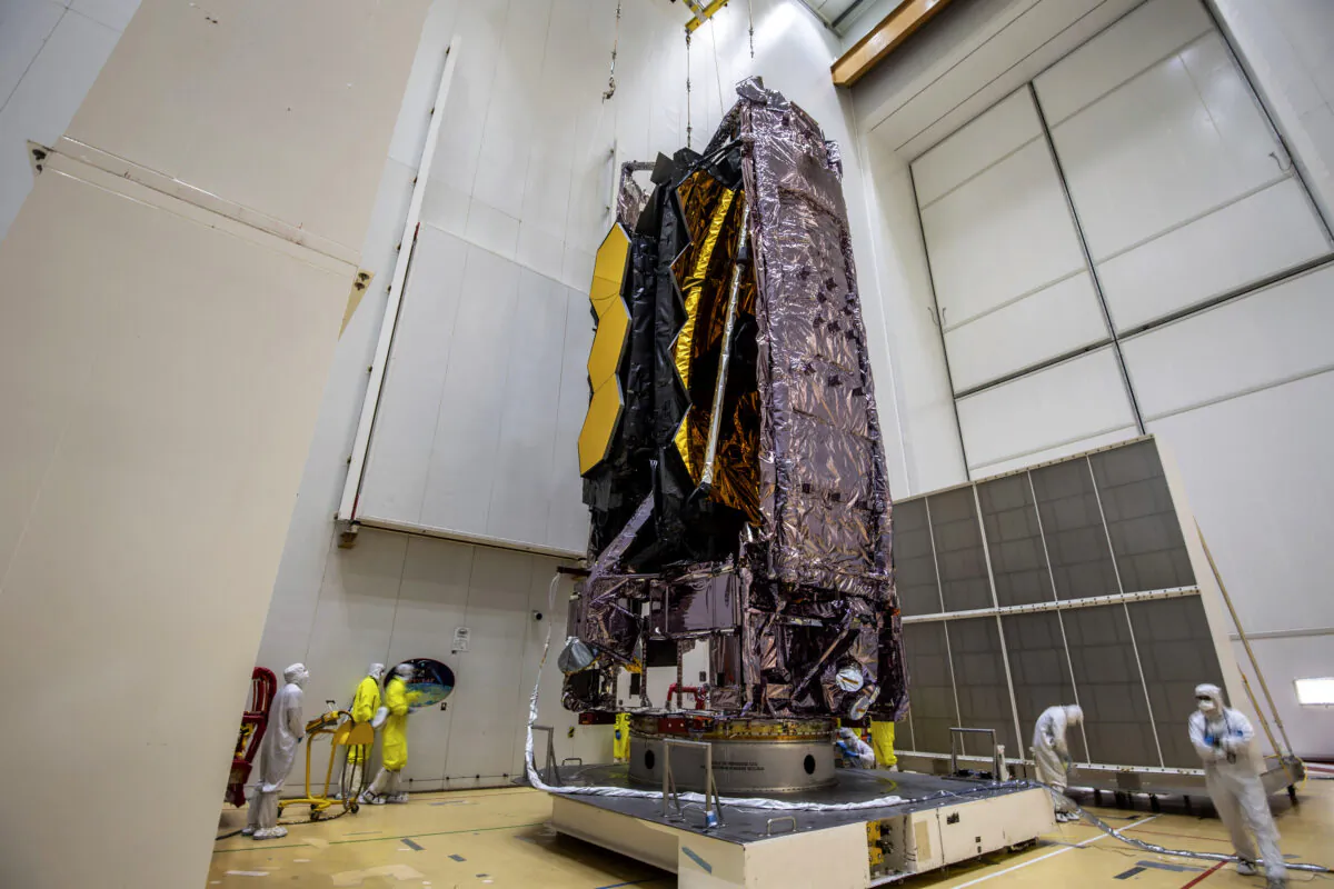 NASA’s James Webb Space Telescope is secured on top of the Ariane 5 rocket that will launch it to space from Europe’s Spaceport in French Guiana, in this photo released by the European Space Agency, on Dec. 11, 2021. (M.Pedoussaut/ESA via AP)