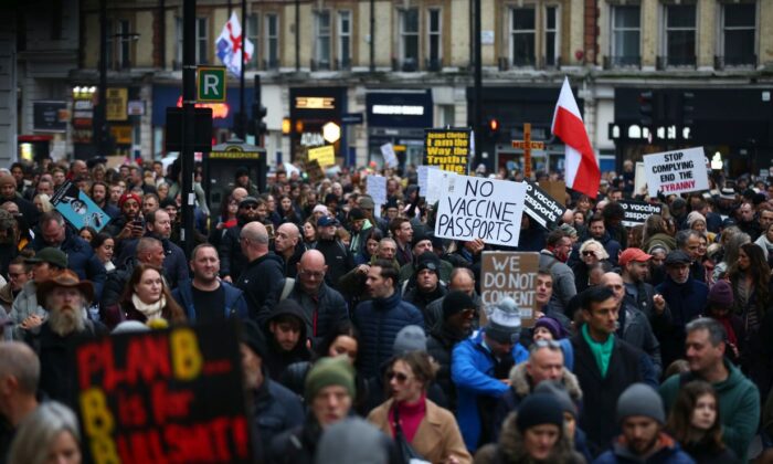 Demonstrators took to the streets against vaccine passports and lockdowns near Victoria Station in London on Dec. 18, 2021. (Hollie Adams/Getty Images)