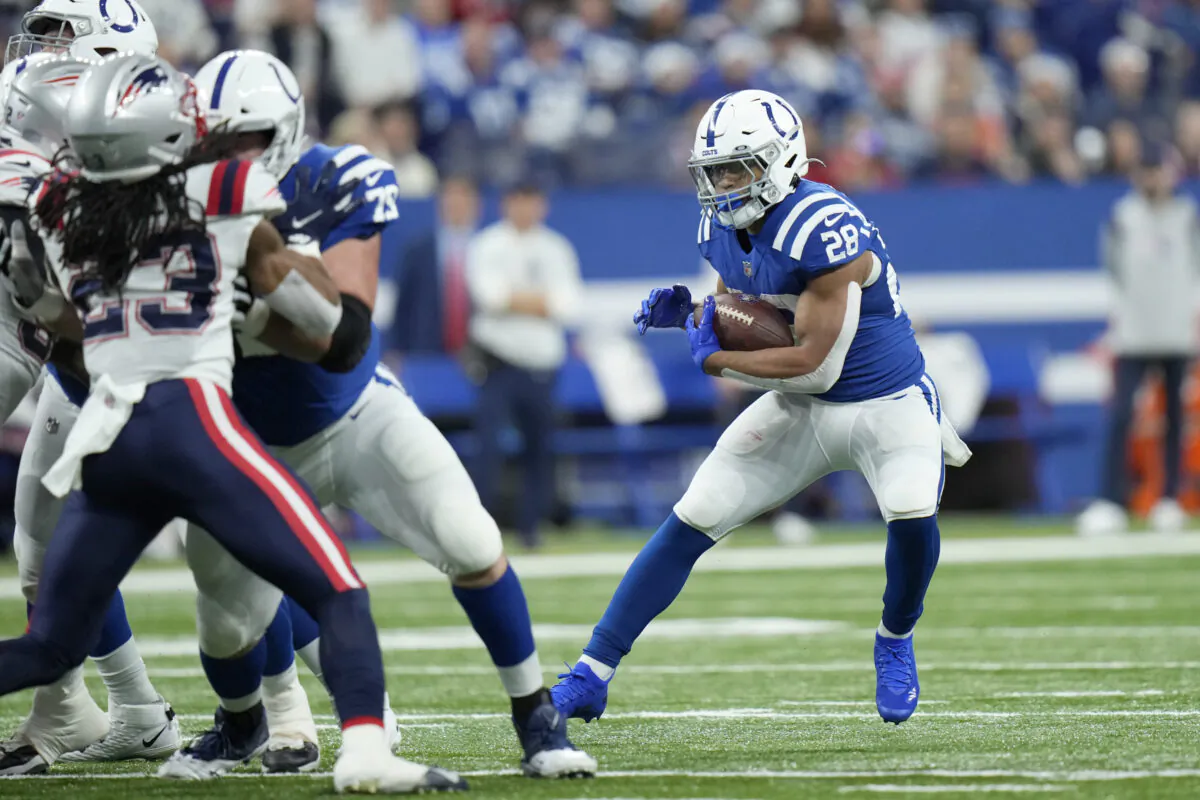 Indianapolis Colts running back Jonathan Taylor (28) runs with the ball during the first half of an NFL football game against the New England Patriots in Indianapolis, on Dec. 18, 2021. (AJ Mast/AP Photo)