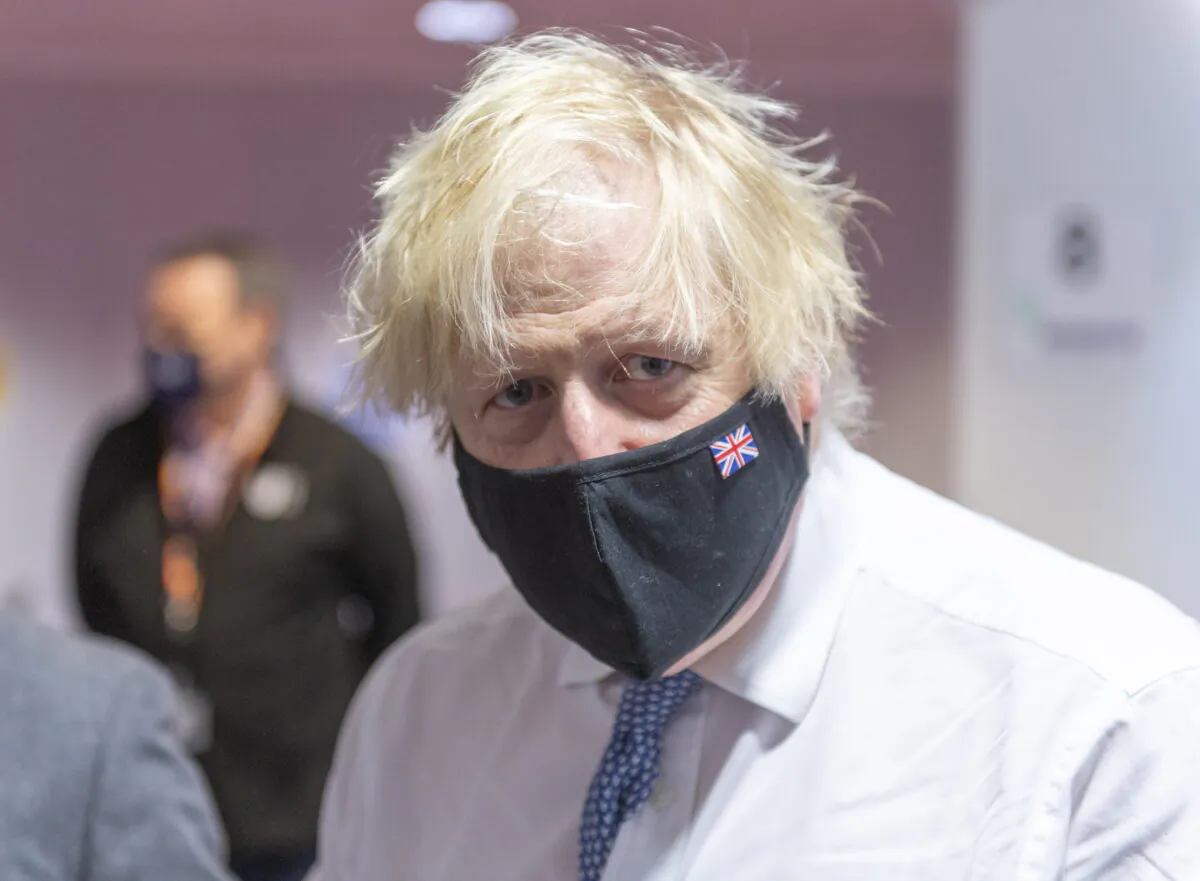 Prime Minister Boris Johnson during a visit to a COVID-19 vaccination centre, in an undated file photo. (Geoff Pugh/Daily Telegraph/PA)
