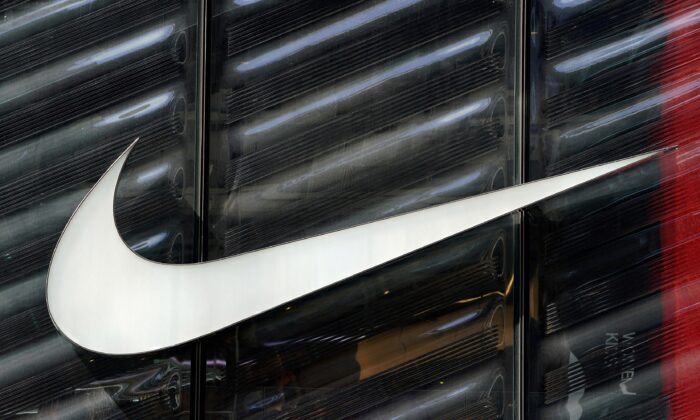 The Nike swoosh logo is seen outside a store on 5th Avenue in New York, on March 19, 2019. (Carlo Allegri/Reuters)