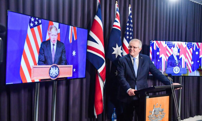 Britain’s Prime Minister Boris Johnson, Australia’s Prime Minister Scott Morrison, and U.S. President Joe Biden at a joint press conference via AVL from The Blue Room at Parliament, in Canberra, Australia, on Sept. 16, 2021. (Mick Tsikas/AAP Image) 